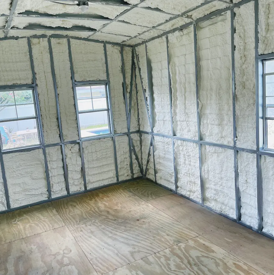 Closed-cell spray foam insulation applied to wall cavities in a residential project in West Bend